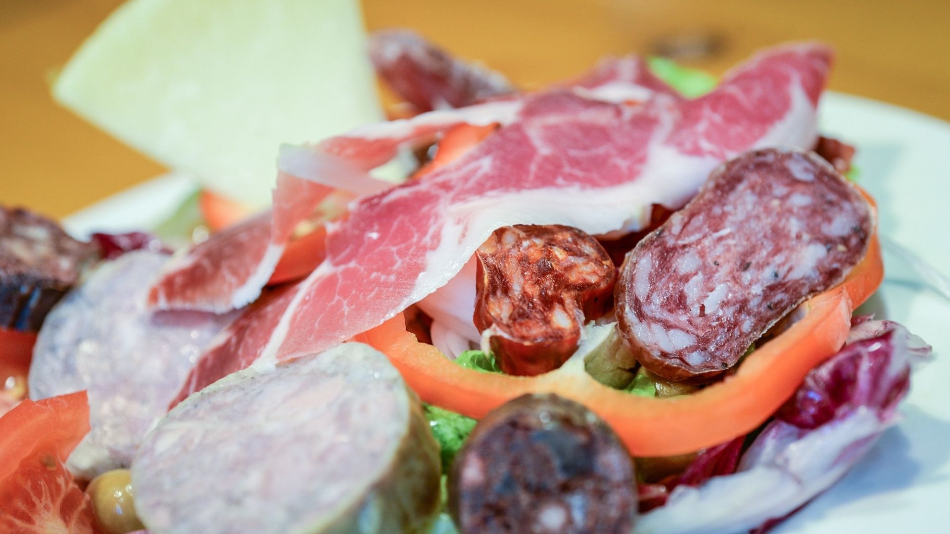 A close-up of a plate of food with meat and vegetables